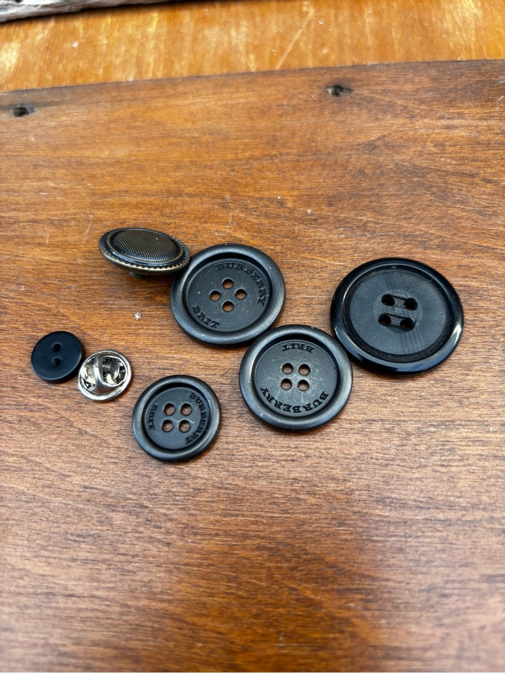 Burberry Black and Brass Cuff Link/Button Set for Men